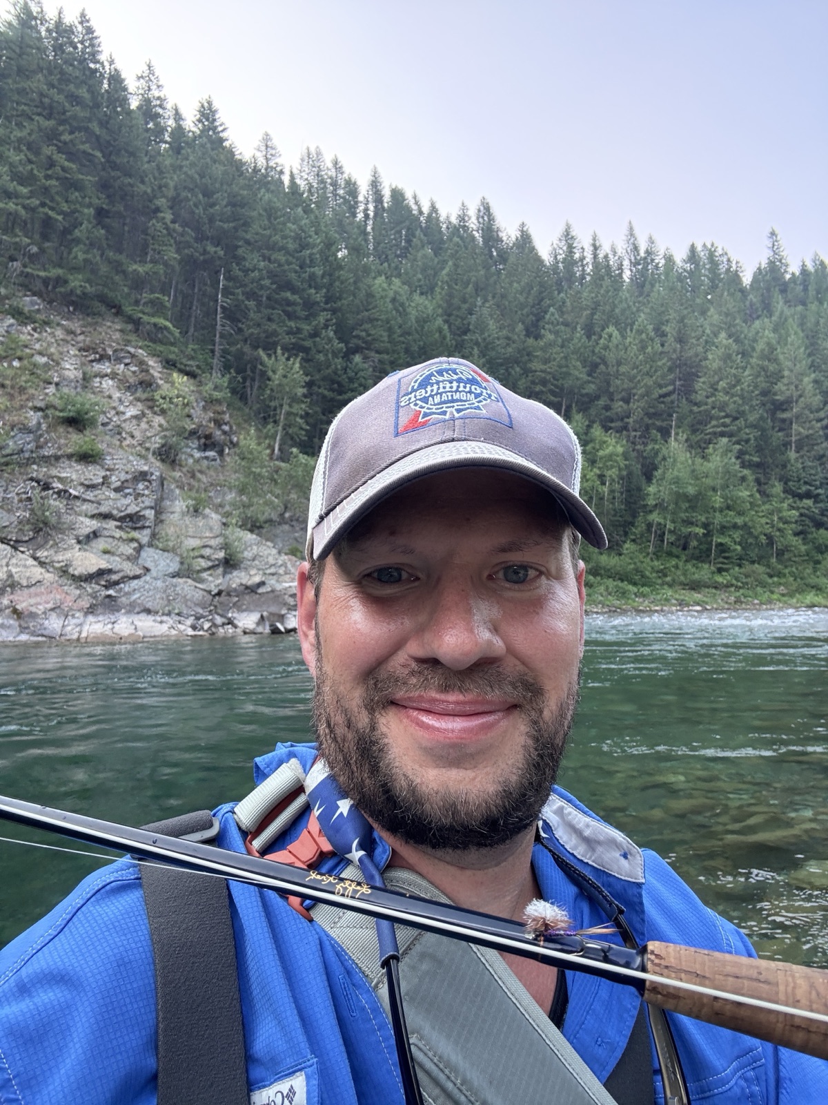 Aaron Makelky in the Middle Fork with the Purple Haze visible on his fly rod.
