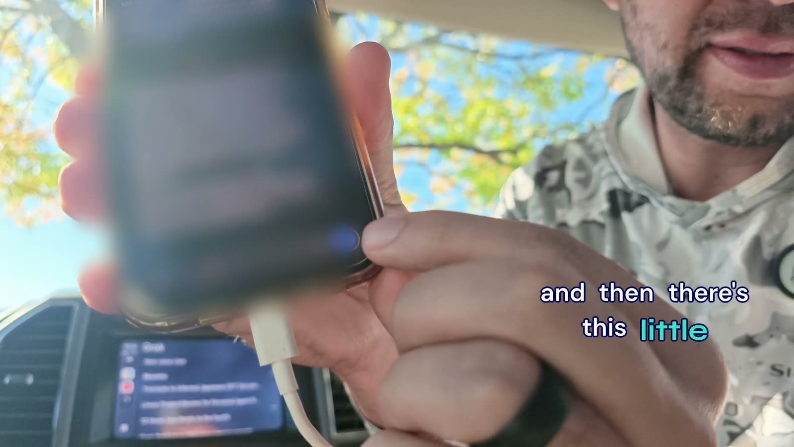 Close-up of the phone during the call with the chat text blurred out.